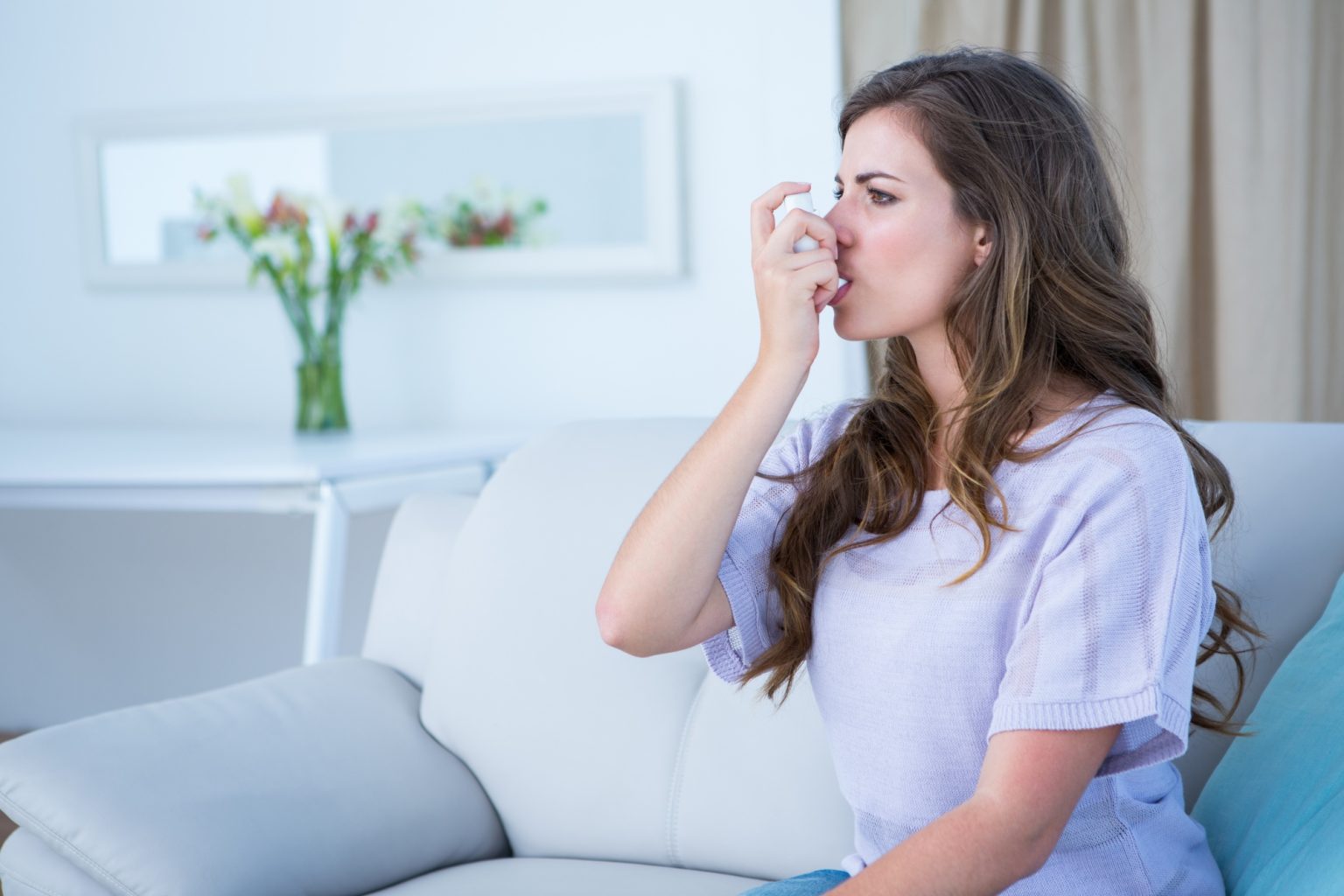 pretty-woman-taking-her-inhaler